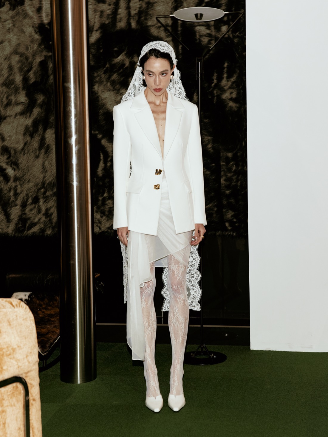 Lichée Bridal SS26 — a modern bride in a white tailored suit and lace veil, full length